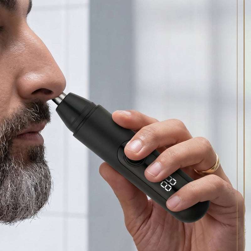 Man using a black electric nose hair trimmer with text '360° Rotary Head' on a light background